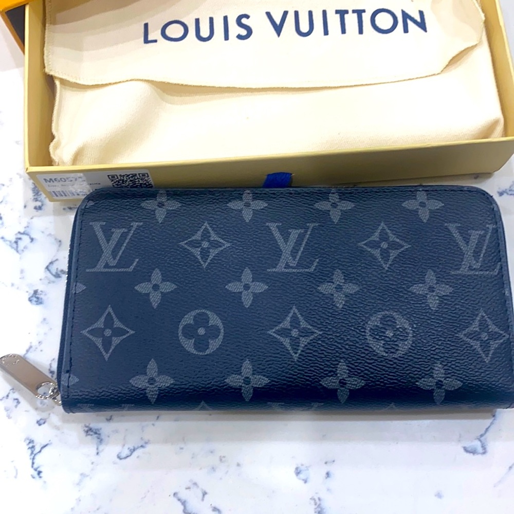 LV wallet . Price reflects authenticity.